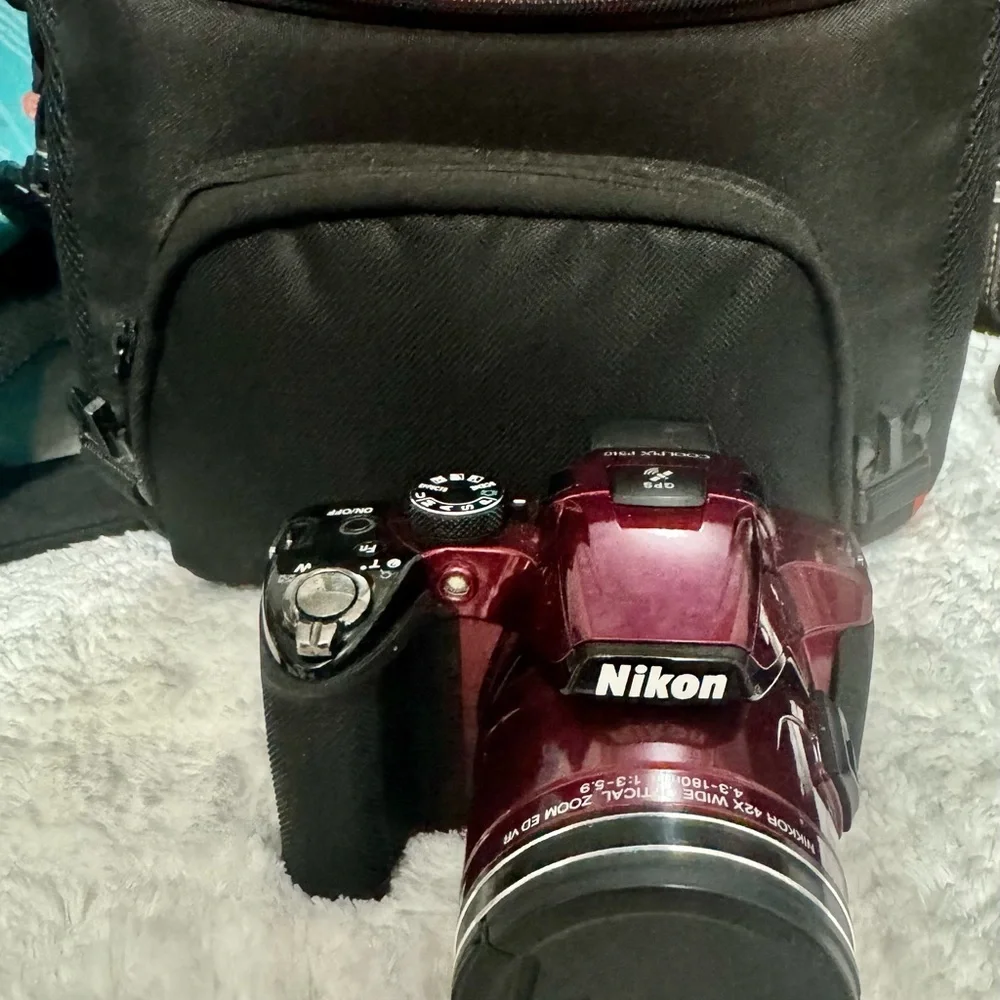 Nikon Red Digital Camera with Zoom Lens and Stylish Design
